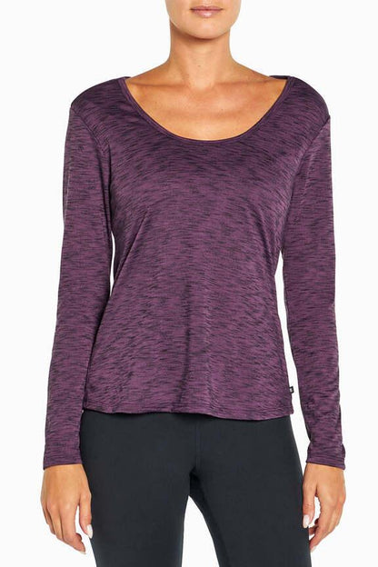 Lotty Long Sleeve Top, side view showing pocket placement, showing visible design features and texture of the soft knit fabric.. 