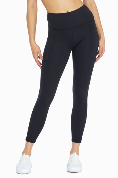 Balance Collection Eclipse Side Pocket Ankle Legging, back view, showing visible design features and texture of the stretch knit fabric.. 