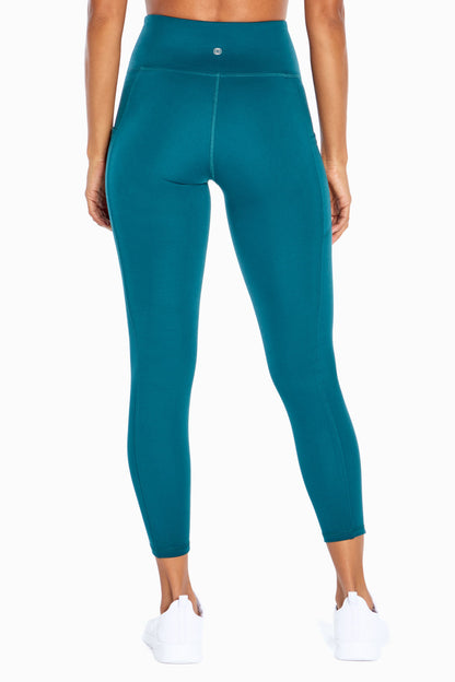 Balance Collection Eclipse Side Pocket Ankle Legging, alternate angle view, showing visible design features and texture of the stretch knit fabric.. 