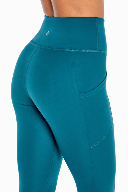 Balance Collection Eclipse Side Pocket Ankle Legging, alternate angle view, showing visible design features and texture of the stretch knit fabric.. 