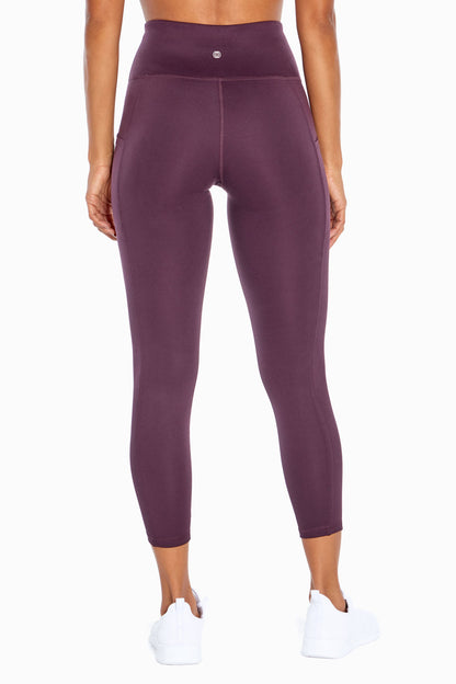 Balance Collection Eclipse Side Pocket Ankle Legging, alternate angle view, showing visible design features and texture of the stretch knit fabric.. 