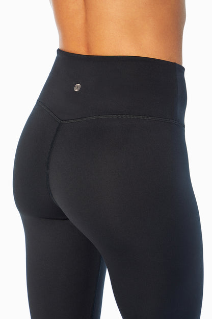 Balance Collection Easy Legging, side view showing pocket placement, showing visible design features and texture of the stretch knit fabric.. 
