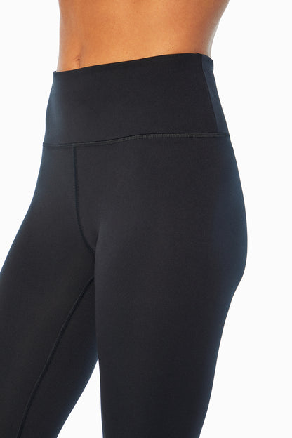Balance Collection Easy Legging, close-up view of fabric and stitching, showing visible design features and texture of the stretch knit fabric.. 